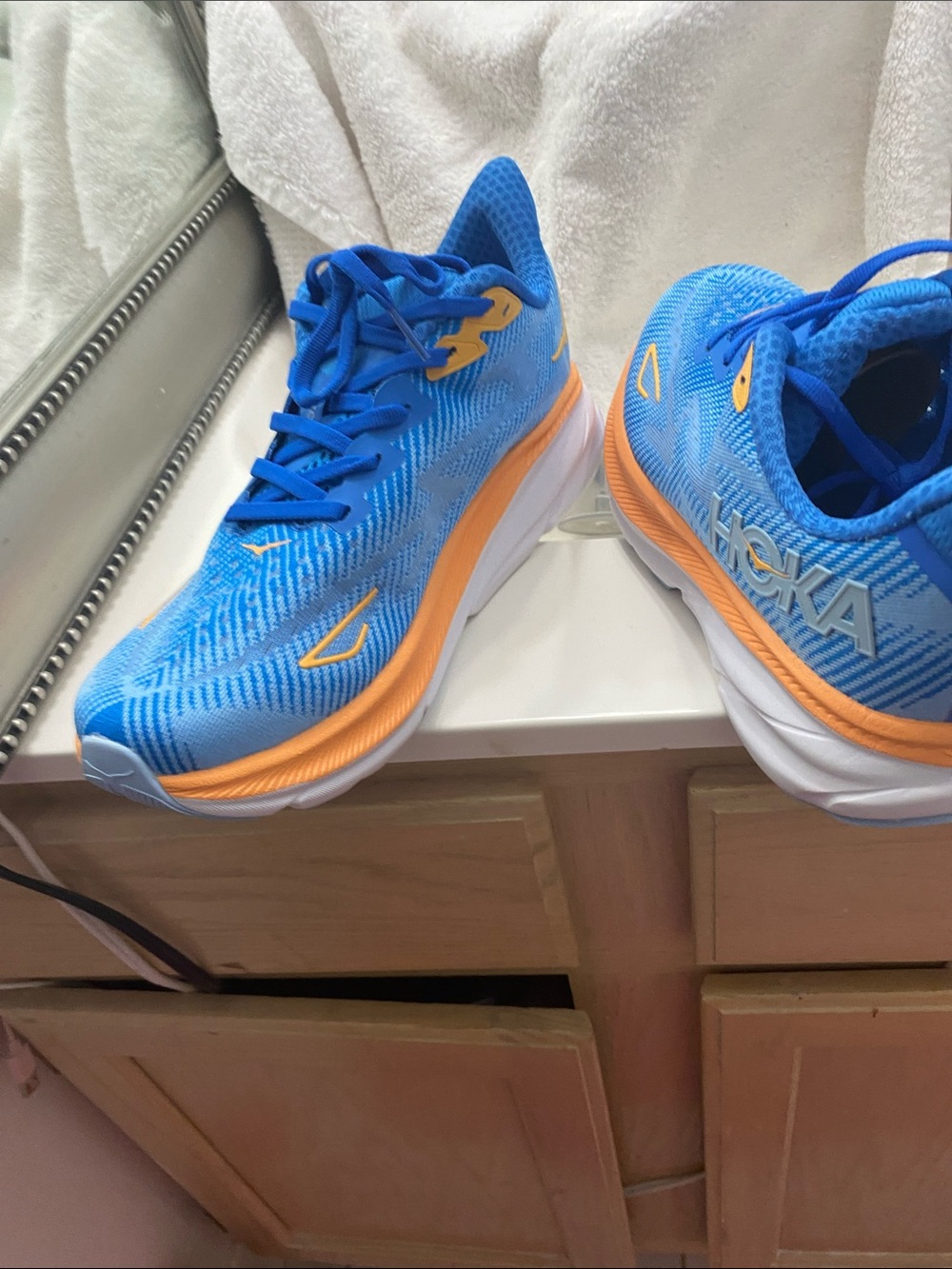 Hoka women Bright Blue Sneakers with Orange Trim